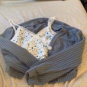 Blue sweater with flower Lacey top underneath